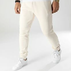 Bon marché ✨ Pantalon Jogging Essentials HE9410 Beige de adidas 🎉